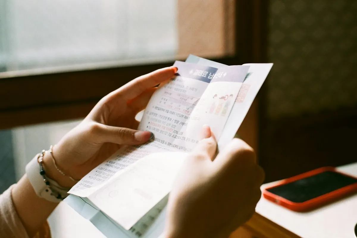 A person reviewing a medical bill