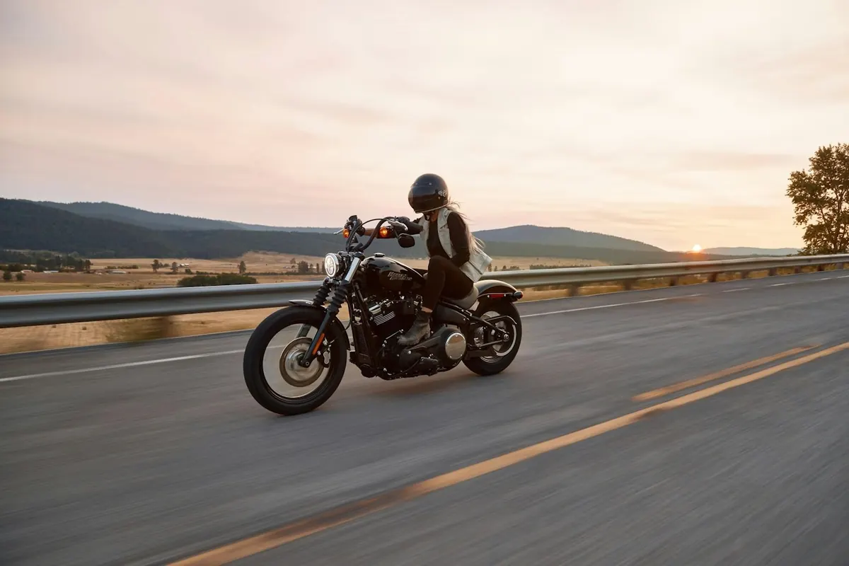 A motorcyclist riding on an open road