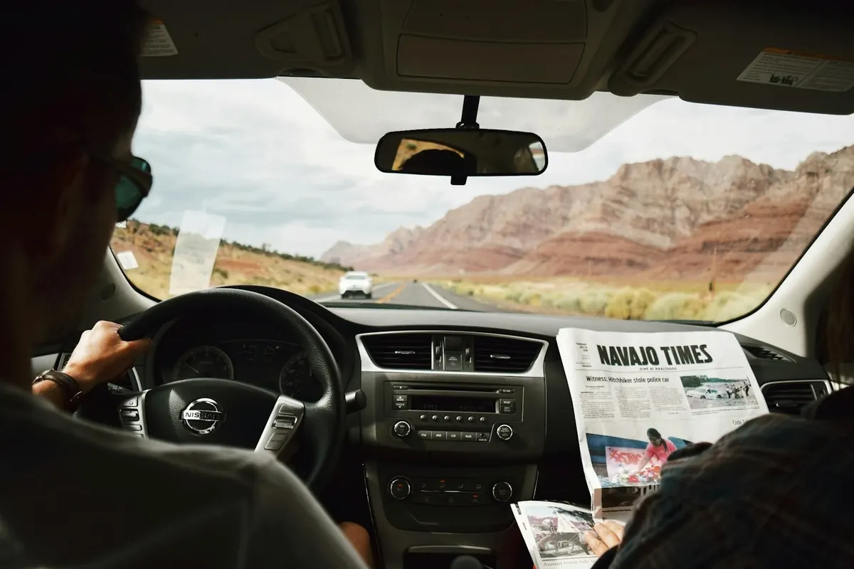 View from the back seat of a car on the road