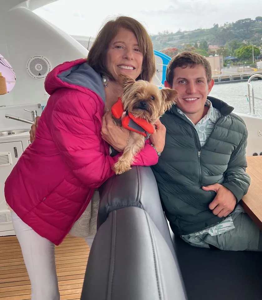Kane and Jonah Handel with Kane's dog, outside the office
